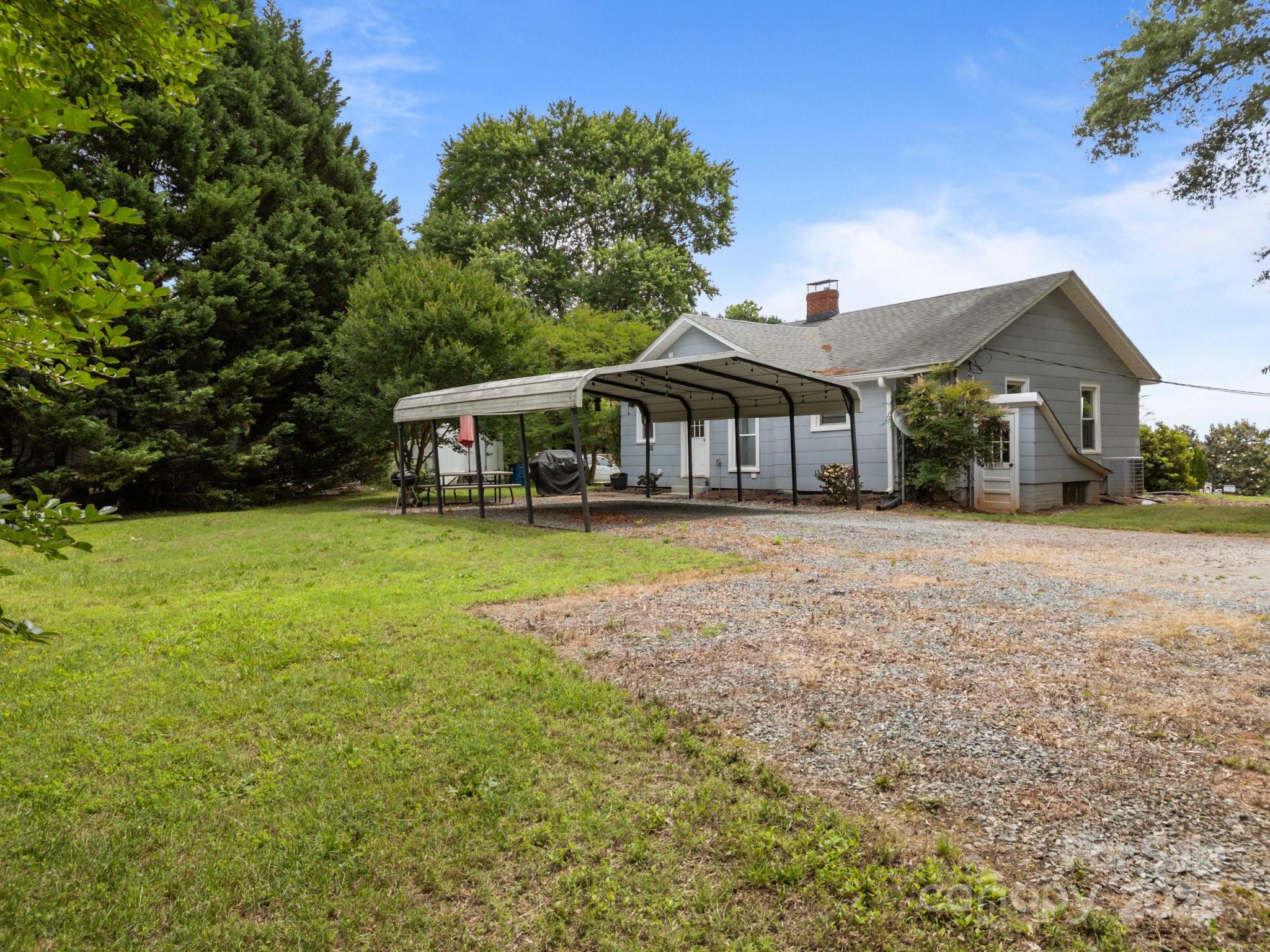 5371 Davidson Road Davidson, NC 28036 - Photo 24 of 27 a view of a house with a yard