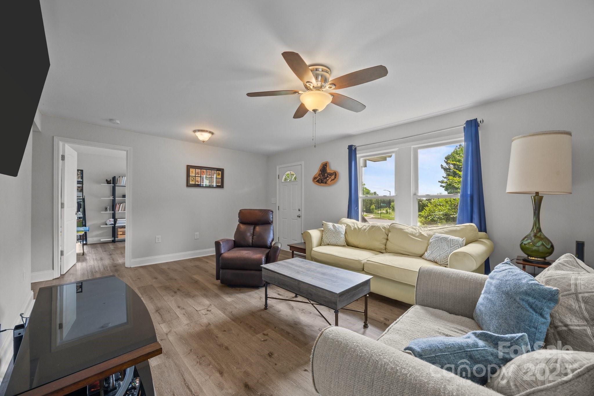 5371 Davidson Road Davidson, NC 28036 - Photo 4 of 27 a living room with furniture and a wooden floor