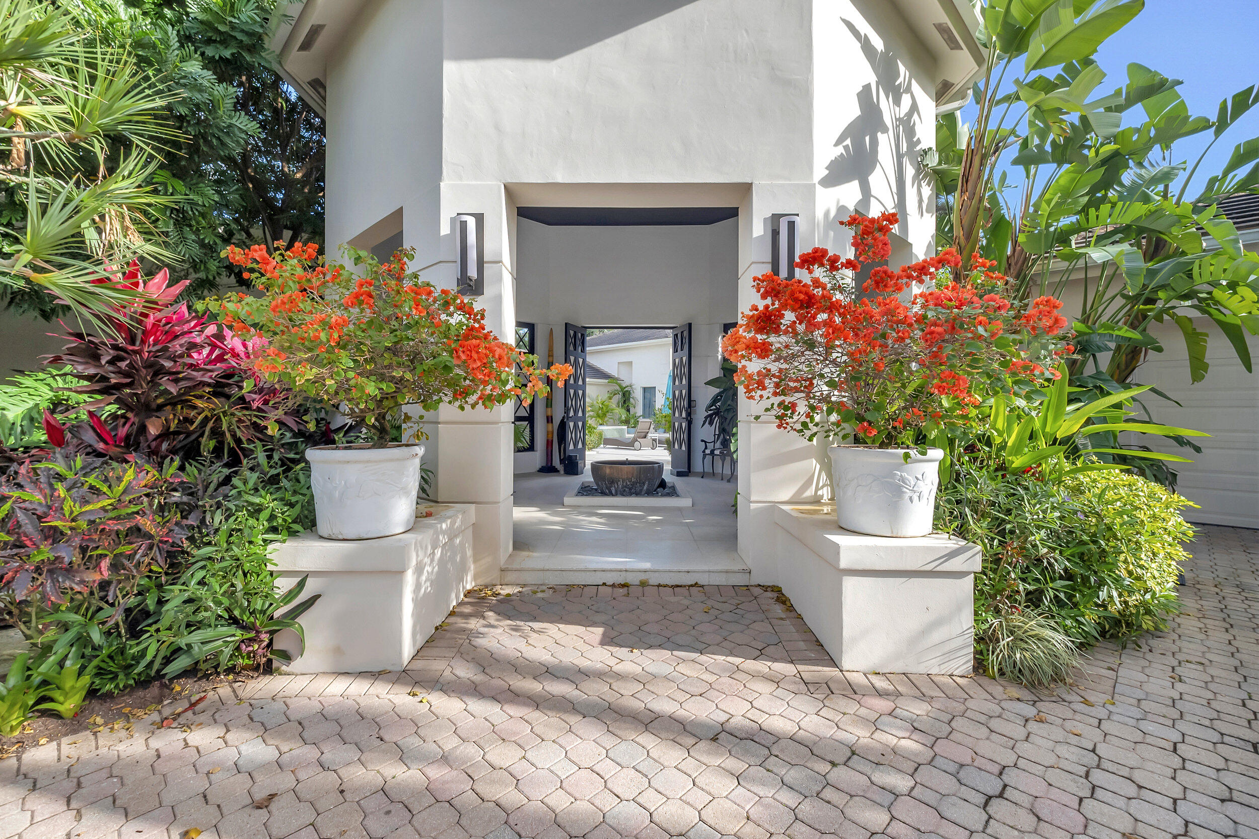 a house with flowers in front of it