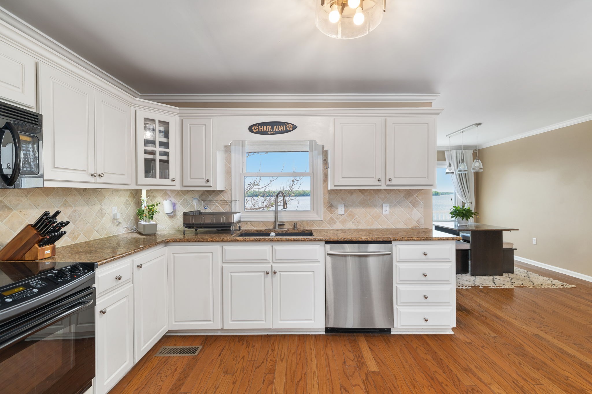 920 County Road 33 Killen, AL 35645 - Photo 16 of 80 a kitchen with granite countertop white cabinets and white appliances