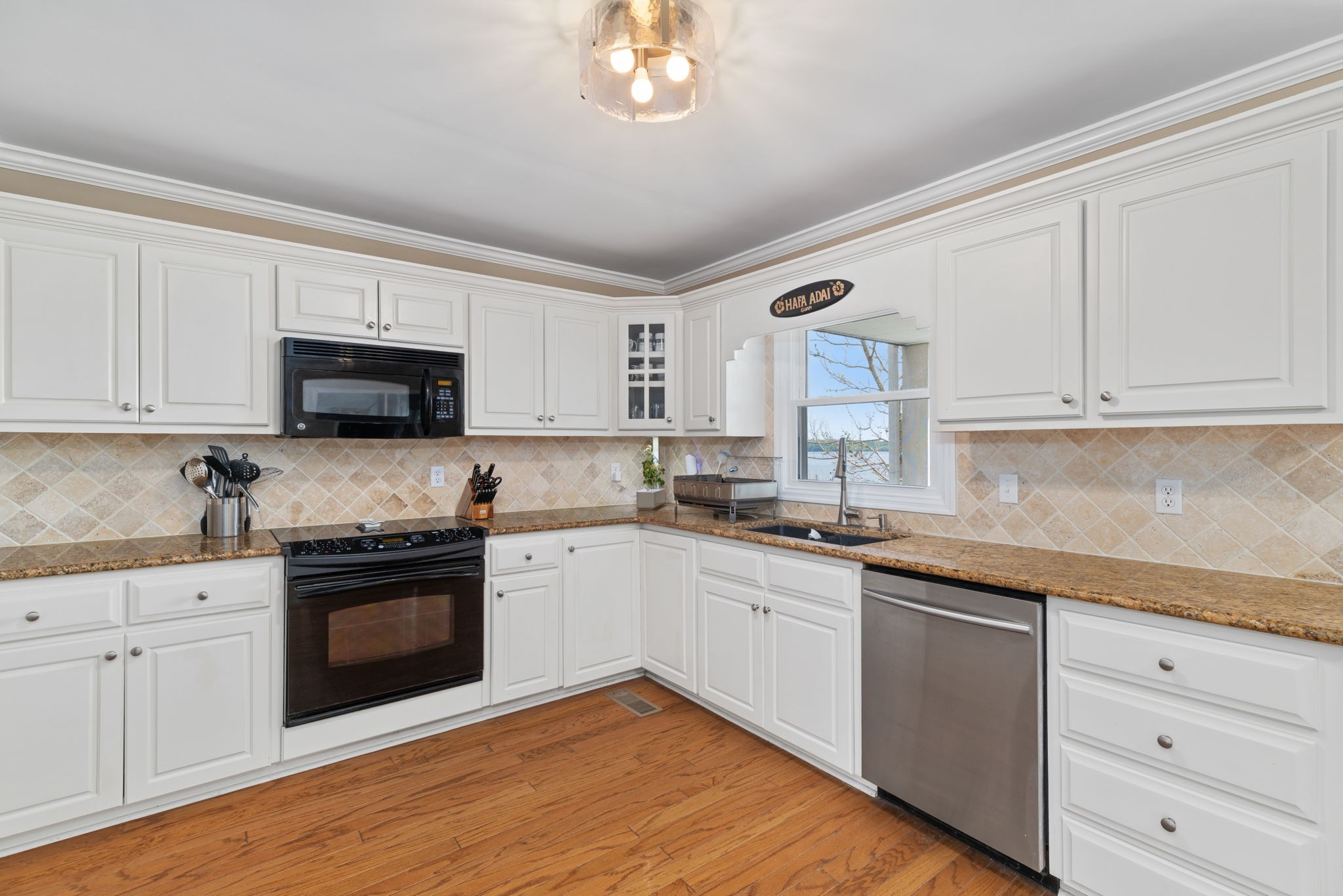 920 County Road 33 Killen, AL 35645 - Photo 19 of 80 a kitchen with granite countertop white cabinets and stainless steel appliances