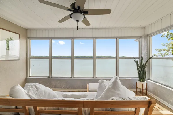 a bathroom with a toilet sink a mirror and vanity