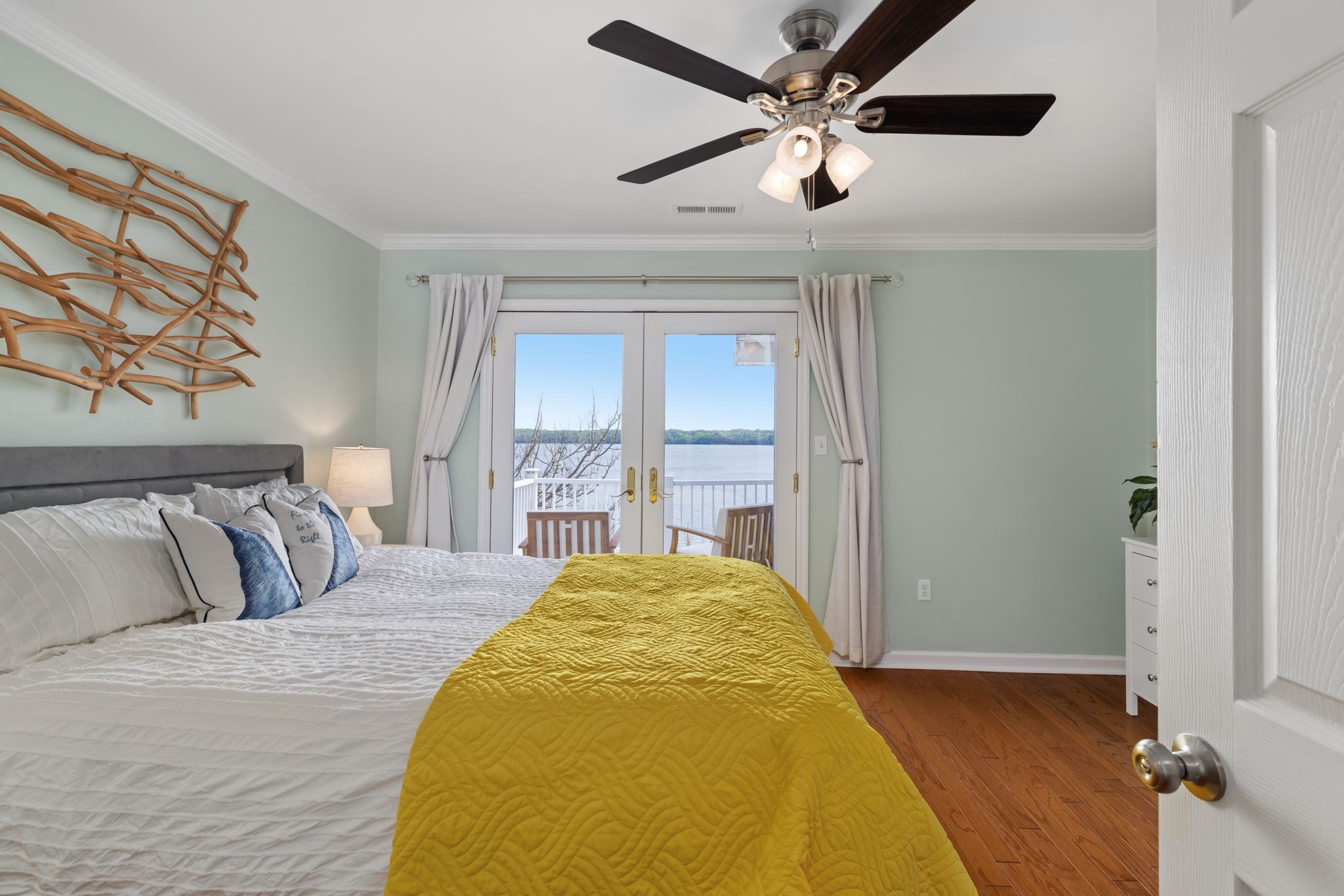 920 County Road 33 Killen, AL 35645 - Photo 34 of 80 a spacious bedroom with a bed and a chandelier