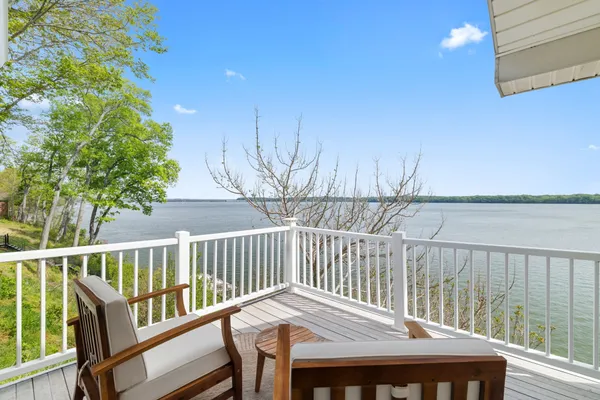 a view of a lake with a house in the background