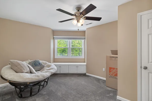 a view of a lake with boats and trees in the background