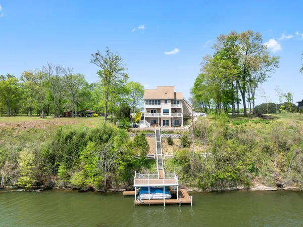 a bathroom with a sink mirror and vanity