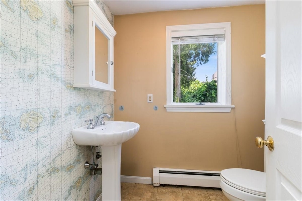 16 Crescent Avenue Beverly, MA 01915 - Photo 15 of 37 a bathroom with a sink toilet and a mirror