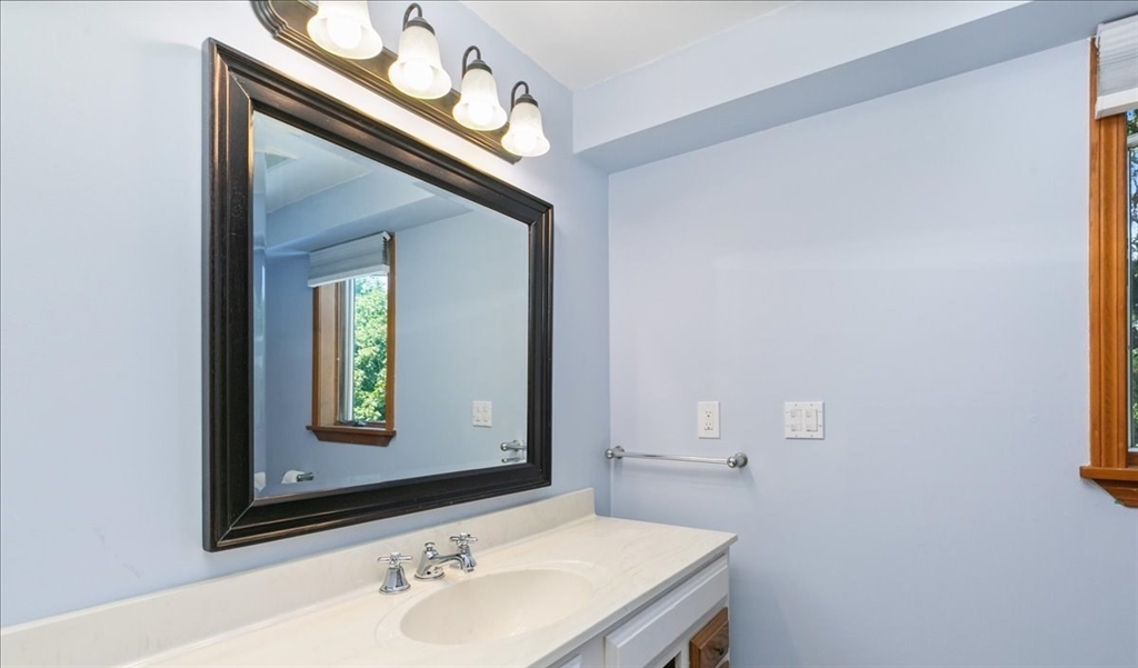 16 Crescent Avenue Beverly, MA 01915 - Photo 19 of 37 a bathroom with a sink and a mirror