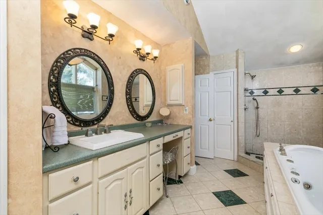 a bathroom with a bathtub and a window
