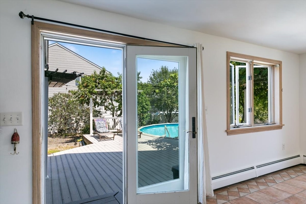 16 Crescent Avenue Beverly, MA 01915 - Photo 10 of 37 a view of a room that has a large window and a balcony