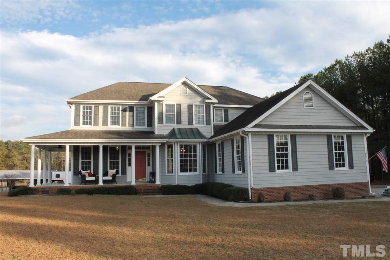 a front view of a house with yard