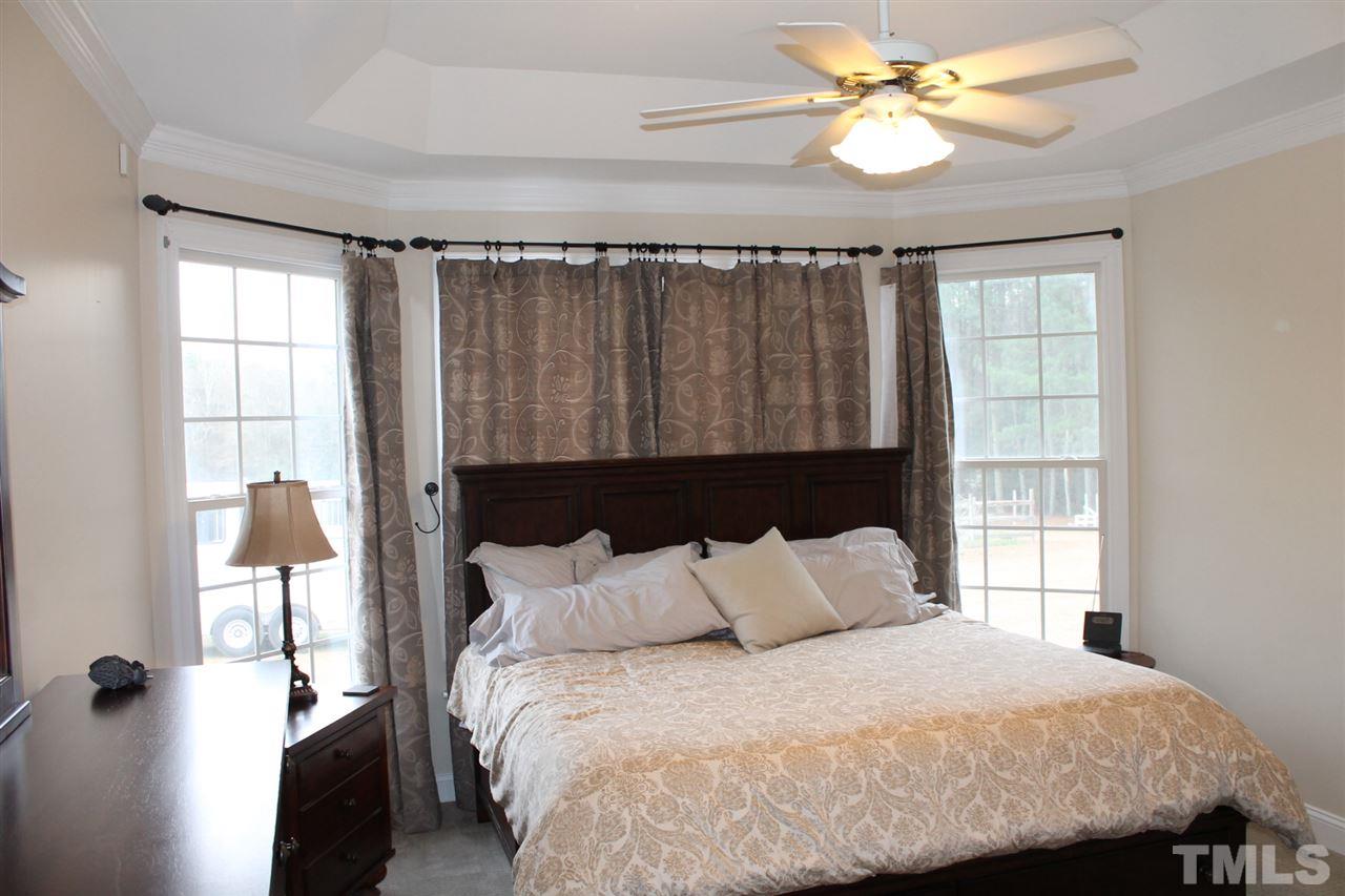 2601 Federal Road Benson, NC 27504 - Photo 13 of 24 a bedroom with a bed and a window