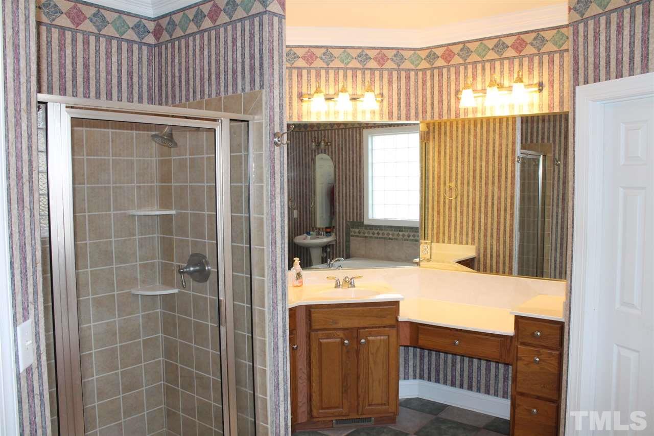 2601 Federal Road Benson, NC 27504 - Photo 14 of 24 a bathroom with a sink and a mirror
