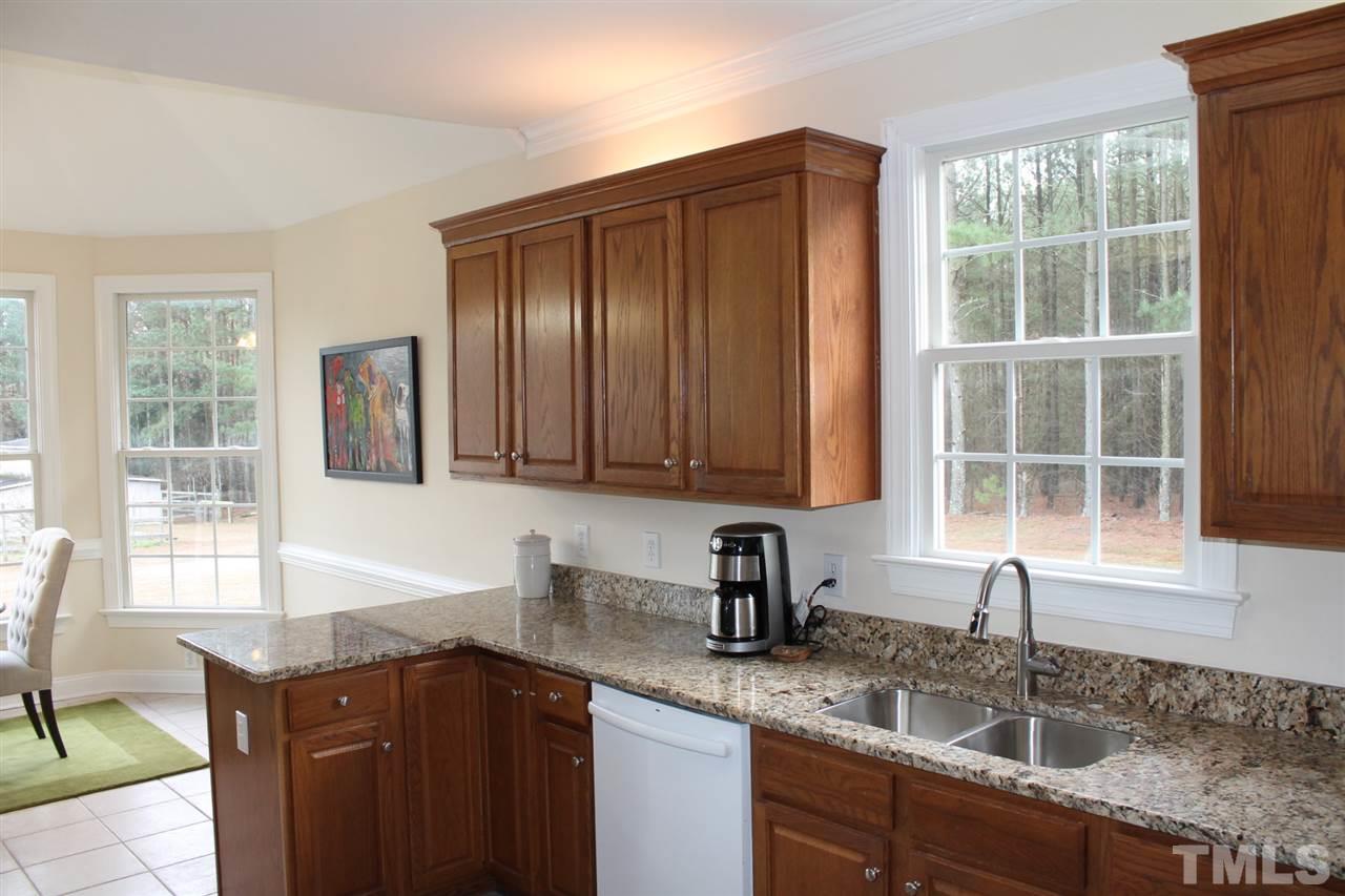 2601 Federal Road Benson, NC 27504 - Photo 6 of 24 a kitchen with granite countertop a sink and a window