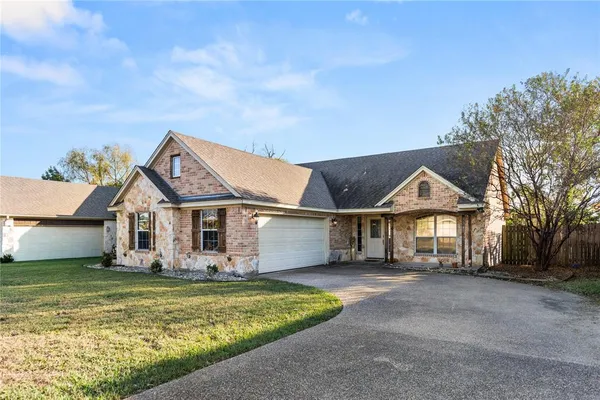 front view of a house with a big yard