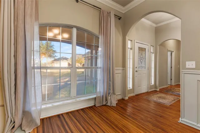 a kitchen with stainless steel appliances granite countertop a refrigerator and wooden cabinets