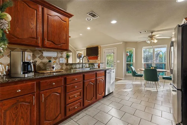 a dining room with furniture and window