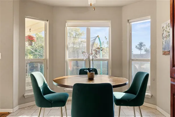 a kitchen with stainless steel appliances granite countertop a refrigerator a stove and a sink with granite countertops