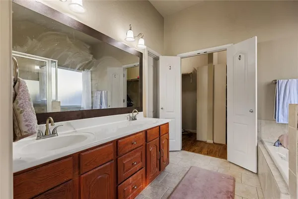 a bathroom with a bathtub and shower