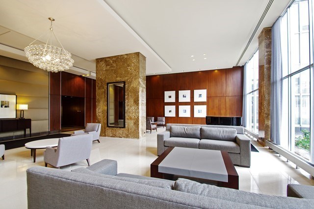 655 West Irving Park Road, Unit 710 Chicago, IL 60613 - Photo 24 of 24 a living room with furniture and a large window