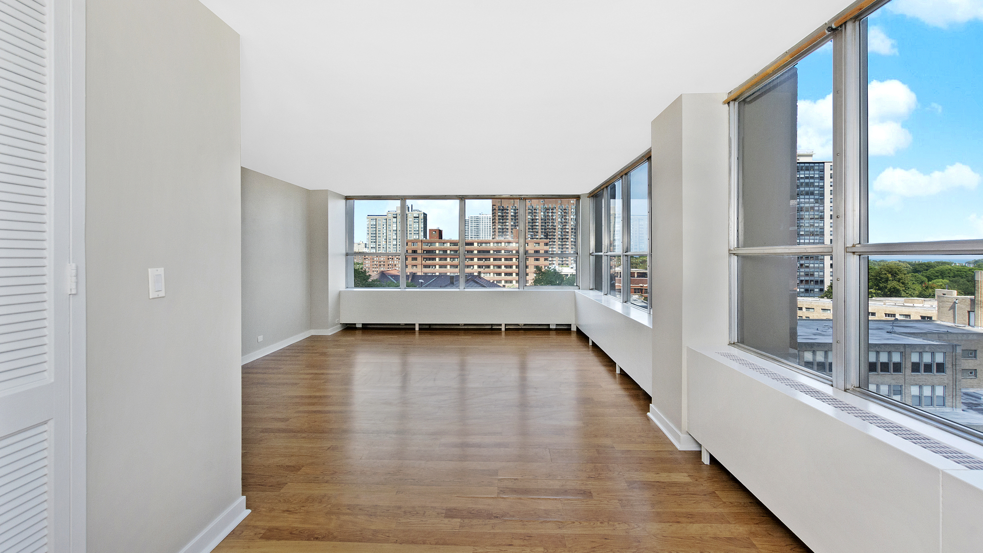 655 West Irving Park Road, Unit 710 Chicago, IL 60613 - Photo 6 of 24 a view of an entryway with wooden floor