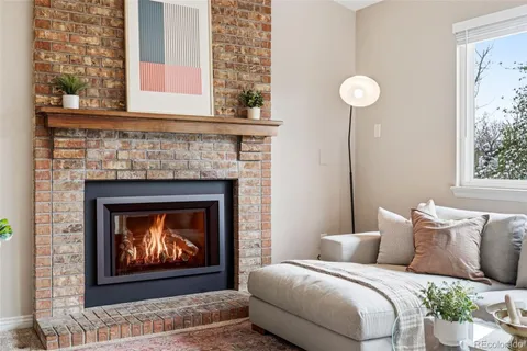 a bedroom with a bed and a fireplace