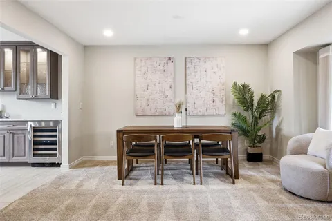 a view of a livingroom with furniture and a potted plant