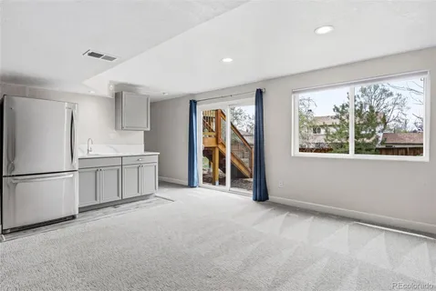 a utility room with cabinets dryer and washer