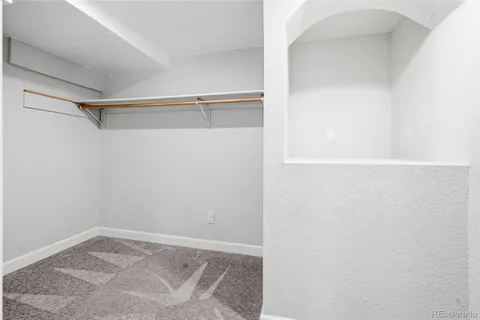 a view of an empty walk in closet