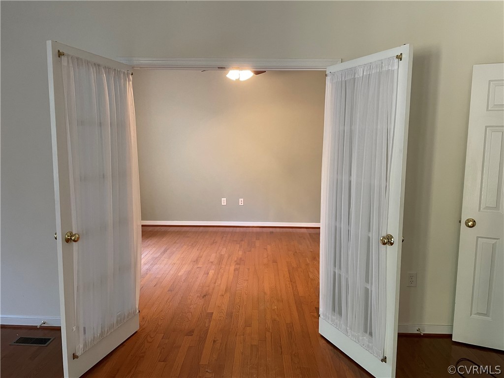 13111 Eppes Falls Road Chesterfield, VA 23838 - Photo 14 of 19 an empty room with wooden floor and a window