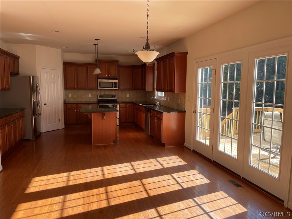 13111 Eppes Falls Road Chesterfield, VA 23838 - Photo 3 of 19 a kitchen with stainless steel appliances granite countertop a refrigerator and a stove top oven