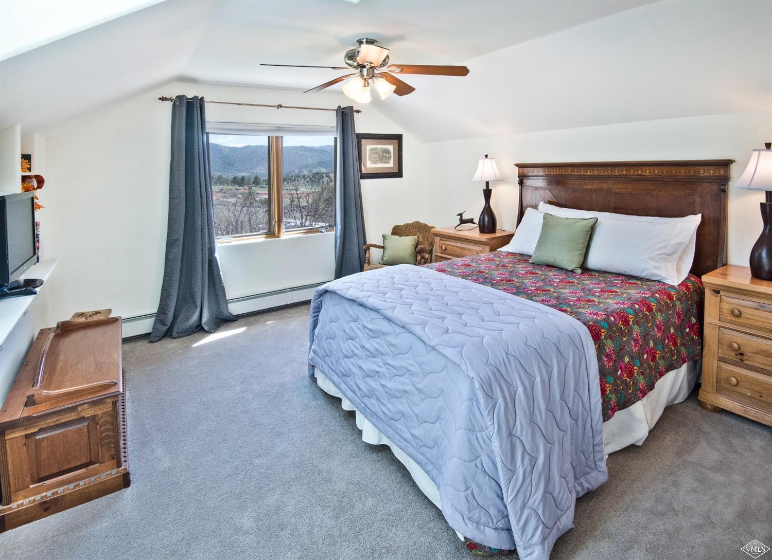 1720 Castle Peak Ranch Road Eagle, CO 81631 - Photo 12 of 25 a bedroom with bed and window