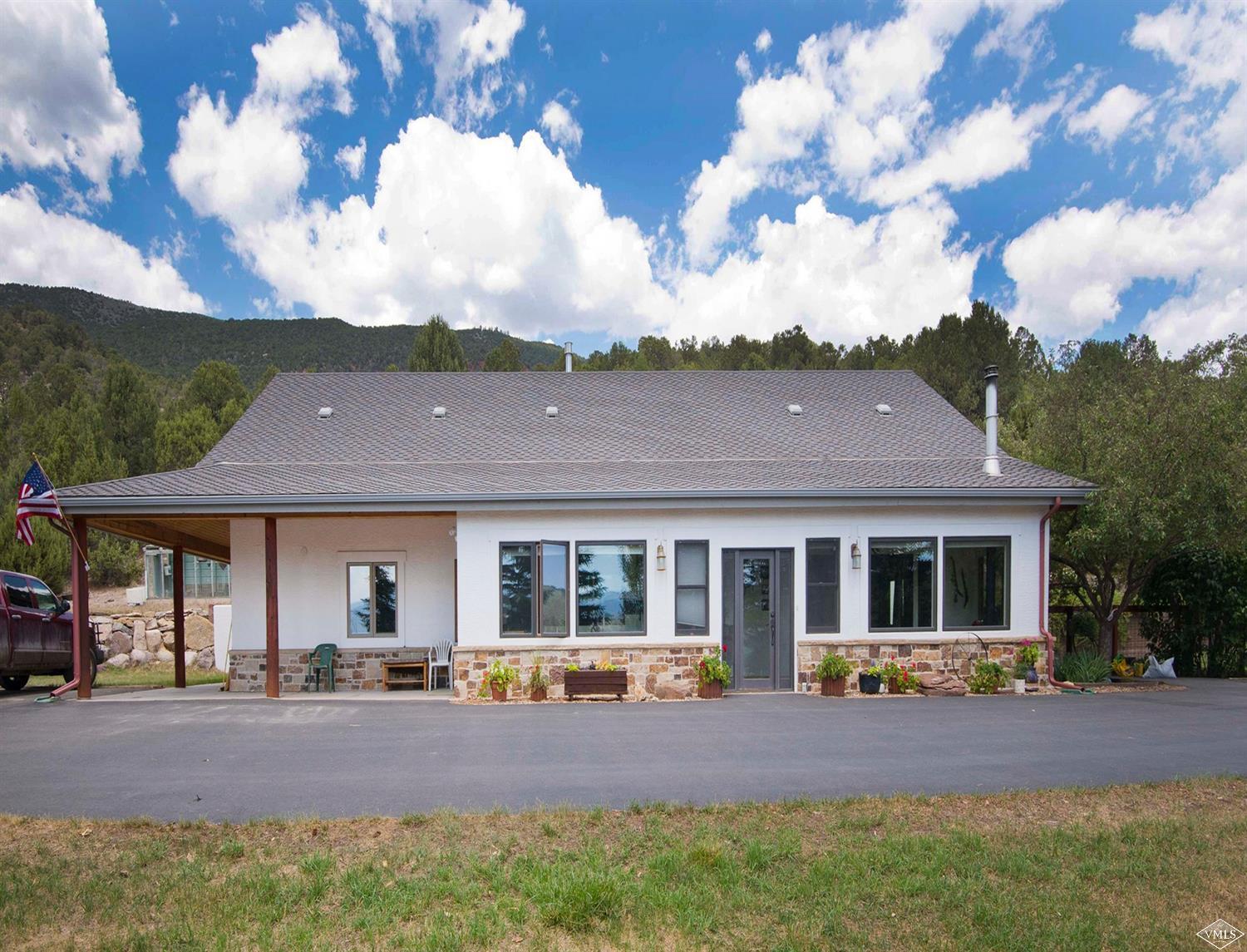 1720 Castle Peak Ranch Road Eagle, CO 81631 - Photo 14 of 25 front view of house with a yard
