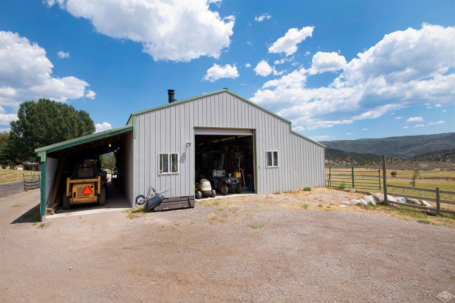1720 Castle Peak Ranch Road Eagle, CO 81631 - Photo 16 of 25 a view of a livingroom with fireplace and a chandelier