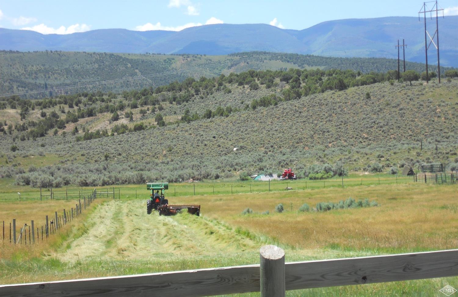 1720 Castle Peak Ranch Road Eagle, CO 81631 - Photo 20 of 25 a view of a lake with a mountain