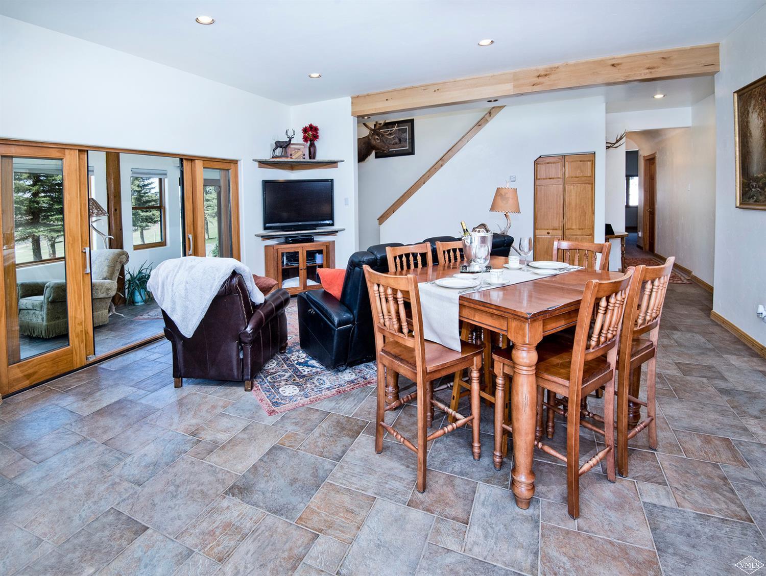 1720 Castle Peak Ranch Road Eagle, CO 81631 - Photo 2 of 25 a view of a dining room with furniture window and wooden floor