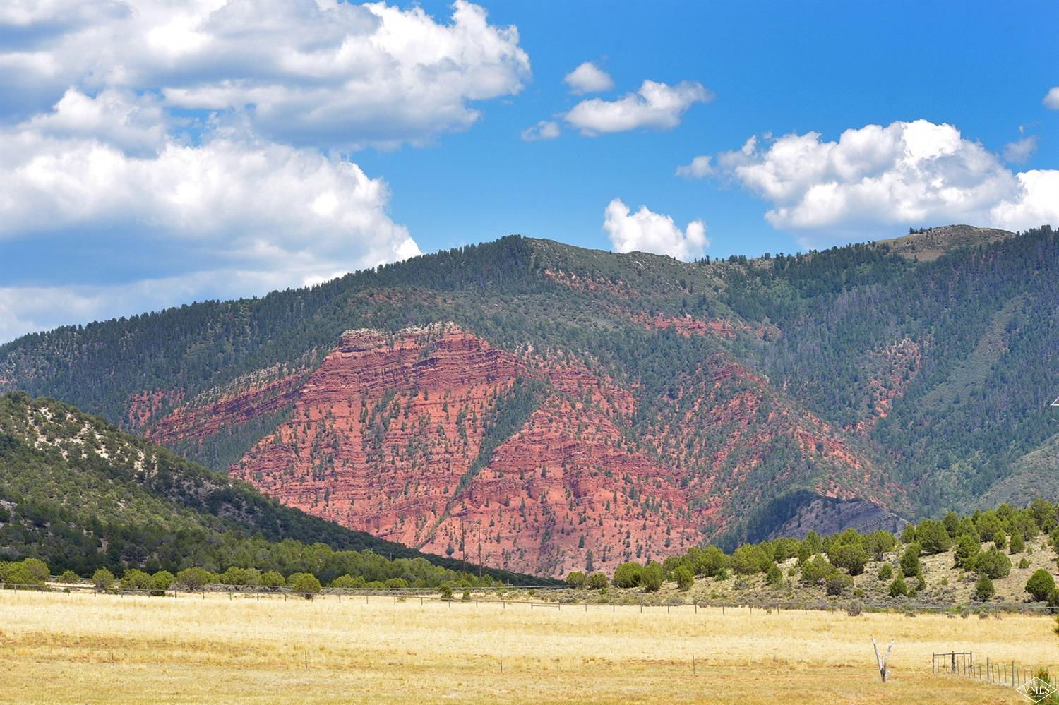 1720 Castle Peak Ranch Road Eagle, CO 81631 - Photo 23 of 25 a view of a lake with a mountain in the background
