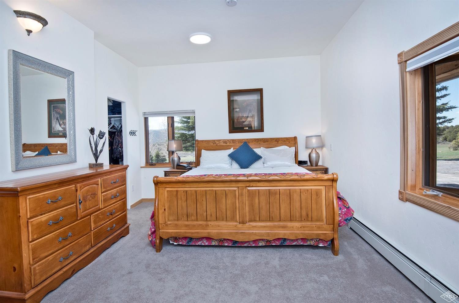 1720 Castle Peak Ranch Road Eagle, CO 81631 - Photo 9 of 25 a bedroom with a bed and a dresser