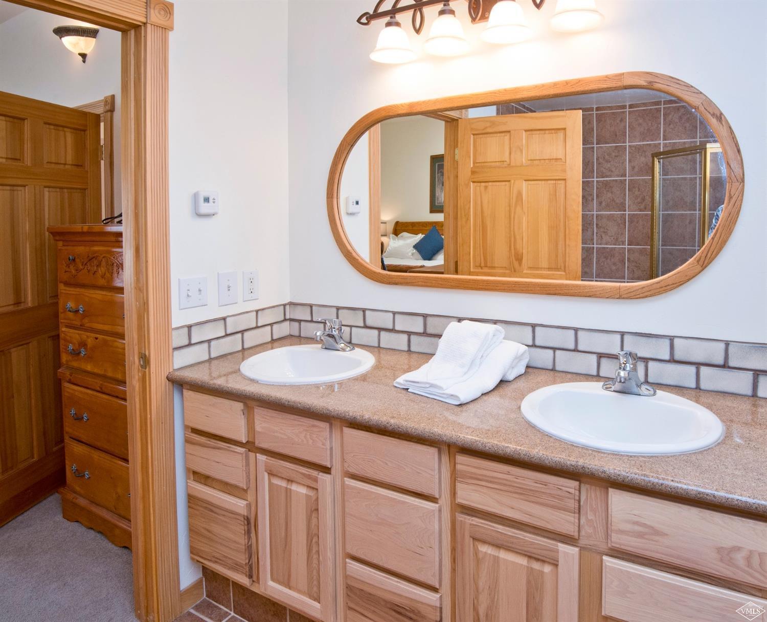 1720 Castle Peak Ranch Road Eagle, CO 81631 - Photo 10 of 25 a bathroom with a sink and a mirror