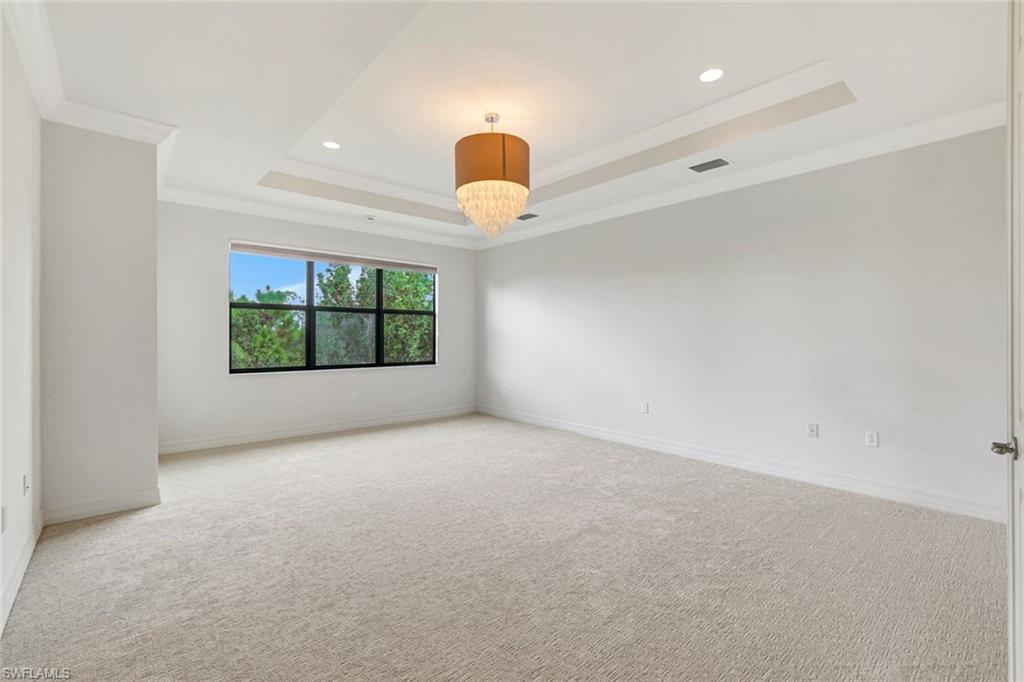 3430 Tigris Lane Naples, FL 34119 - Photo 18 of 48 an empty room with windows