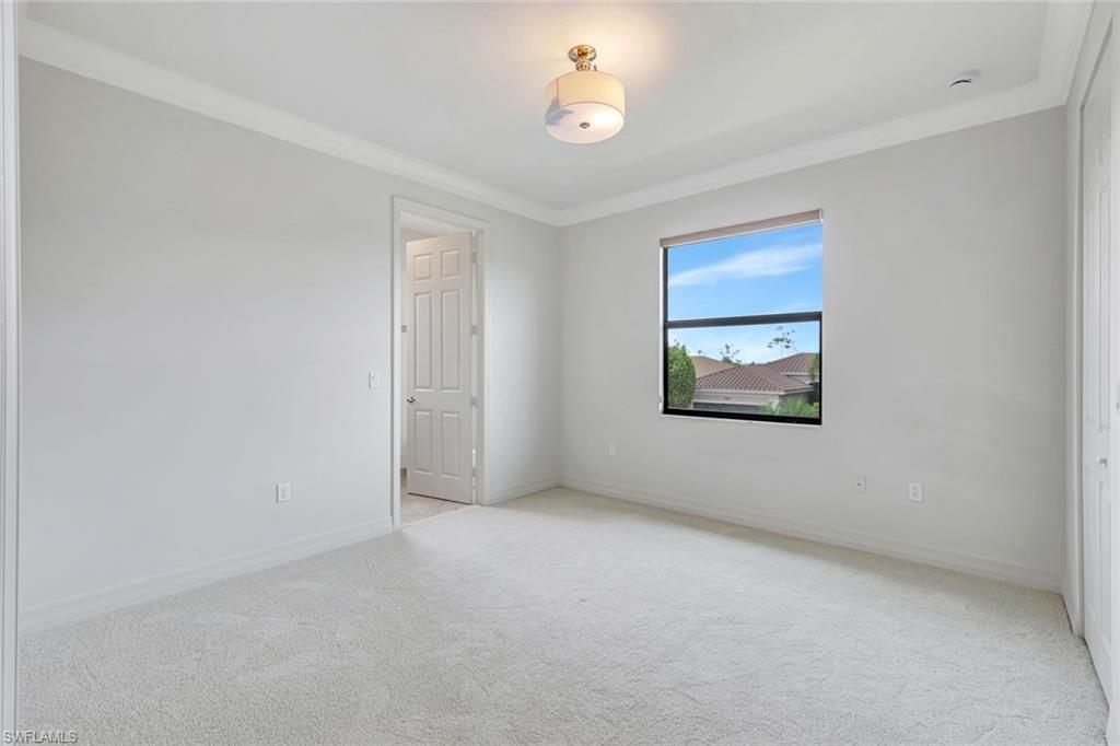 3430 Tigris Lane Naples, FL 34119 - Photo 25 of 48 an empty room with a empty space and a window