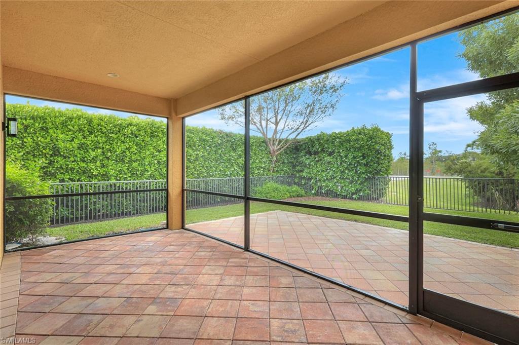 3430 Tigris Lane Naples, FL 34119 - Photo 31 of 48 a view of empty room with wooden floor and fan