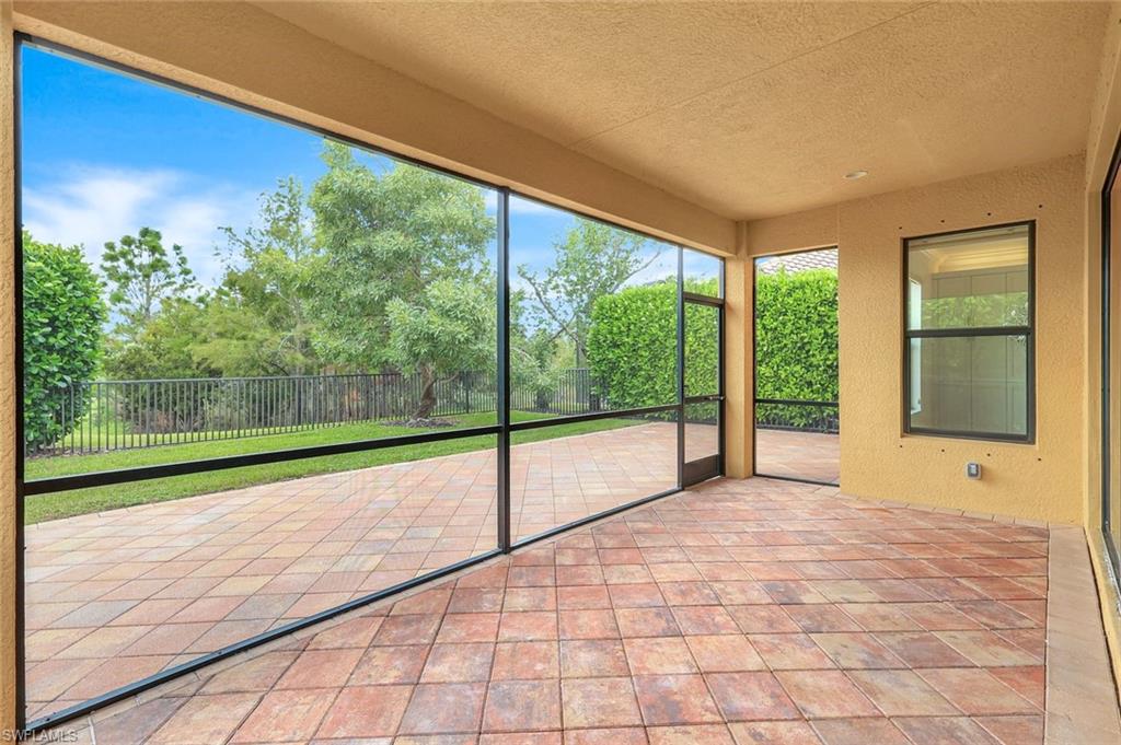 3430 Tigris Lane Naples, FL 34119 - Photo 32 of 48 a view of a room with window and wooden floor