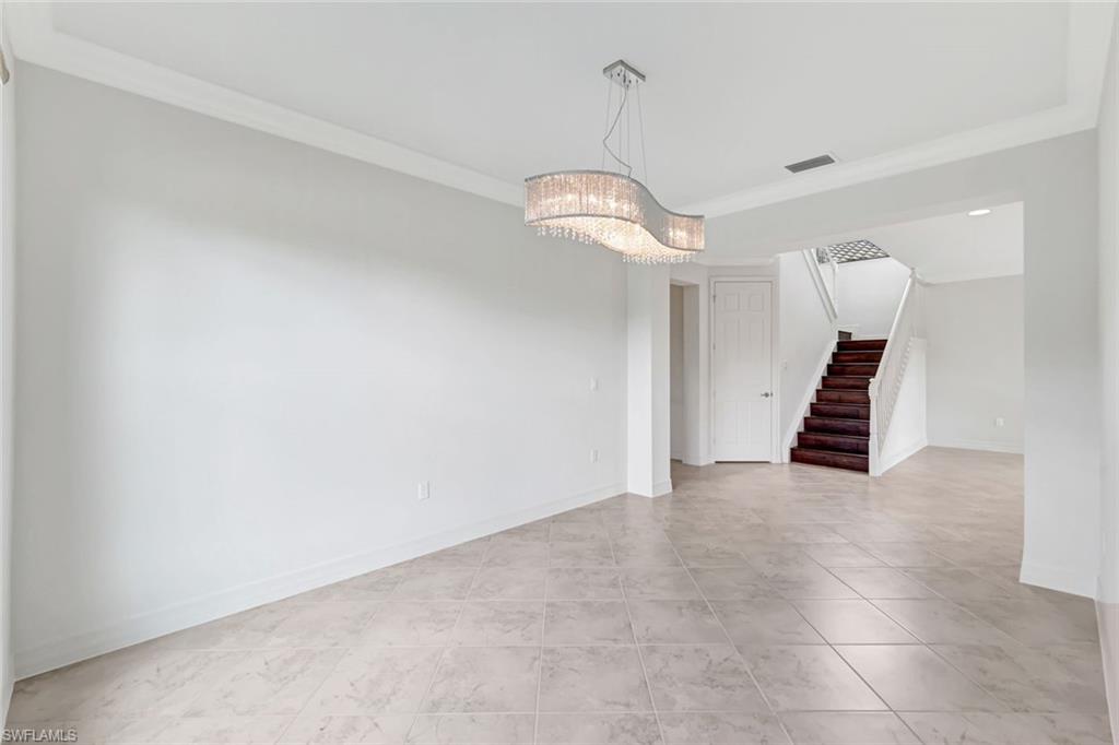 3430 Tigris Lane Naples, FL 34119 - Photo 10 of 48 a view of an empty room with stairs and ventilation