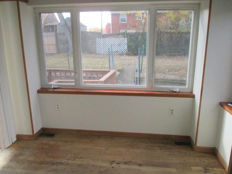 1492 Merriman Road Ambridge, PA 15003 - Photo 18 of 43 a view of a small space with wooden floor and a window