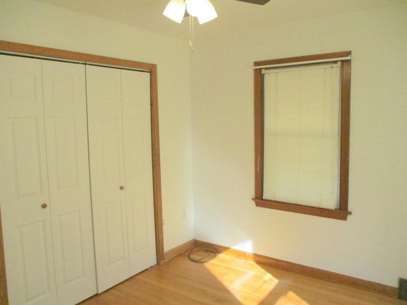 1492 Merriman Road Ambridge, PA 15003 - Photo 30 of 43 a view of a room with wooden floor and a window