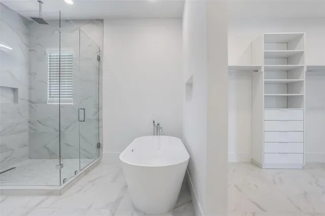 a bathroom with a shower and toilet