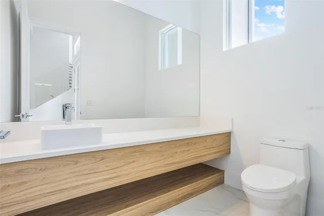 a bathroom with a vanity and a toilet