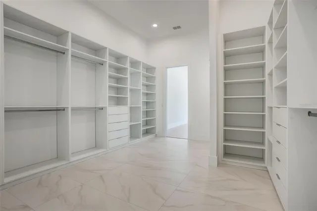 a view of an empty walk in closet