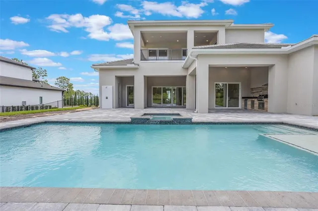 a front view of house with outdoor space and lake view